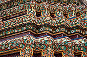 Bangkok Wat Pho, the group of the chedi of the four kings, detail of multicolored mosaic flowers made from Chinese ceramic bowls cut into petal shapes. 